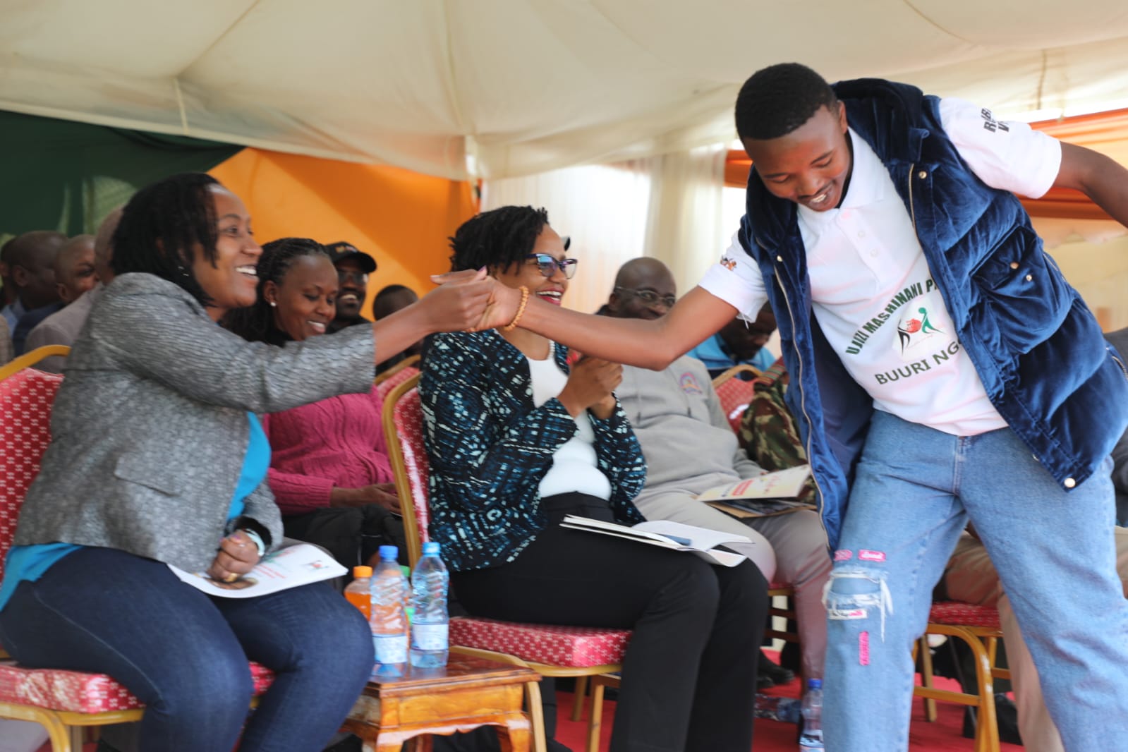 Ag CEO having a light moment with a graduand.